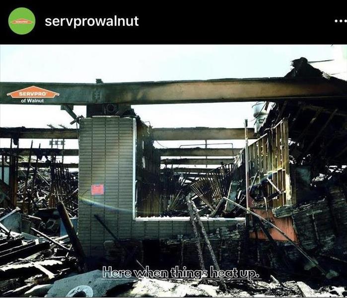 A building that has been decimated by a fire. The caption "Here when things heat up" is featured at the bottom of the image.